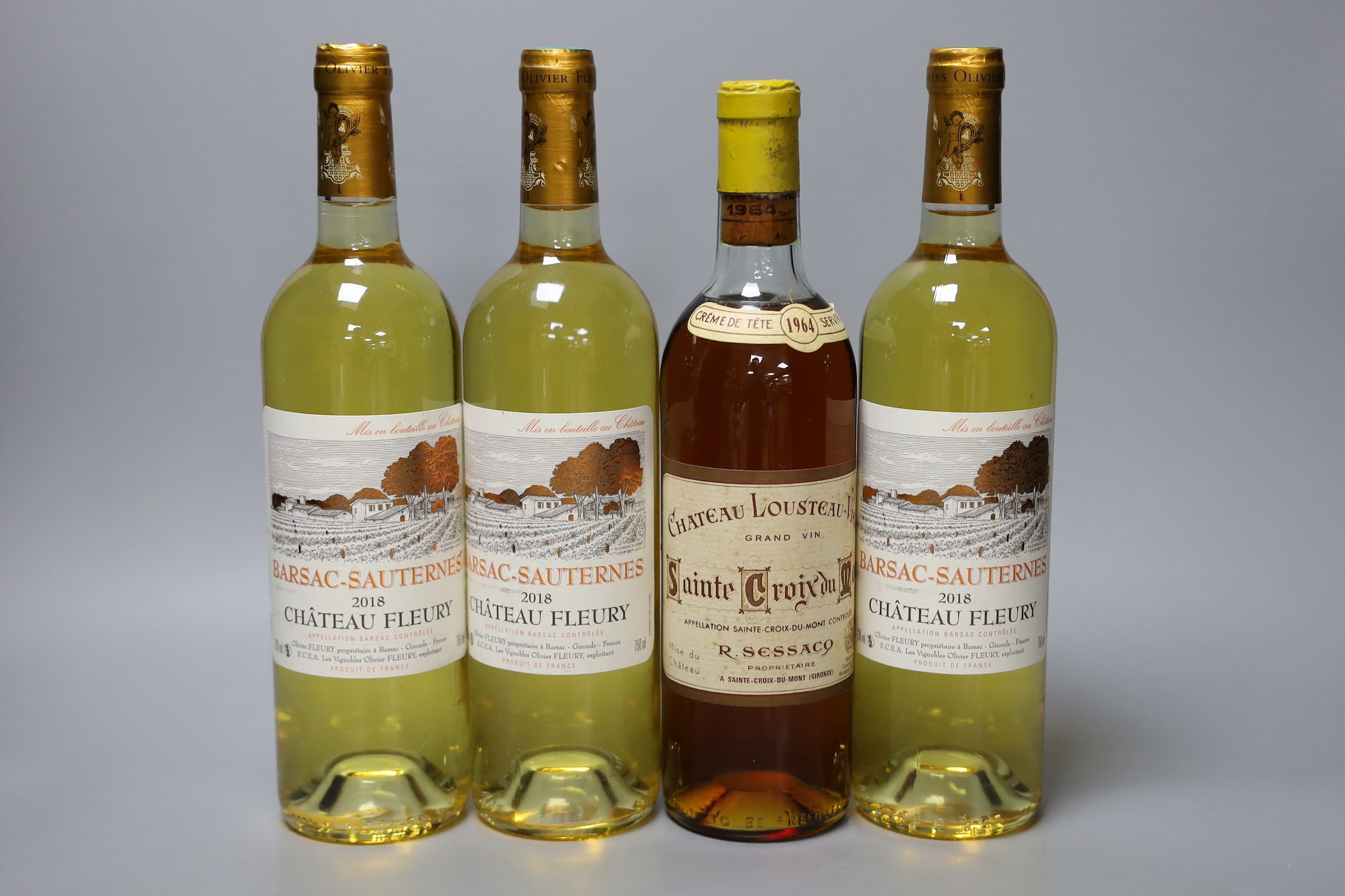 A bottle of Chateau Lousteau-Vieil 1964 and three bottles of Chateau Fleury 2018